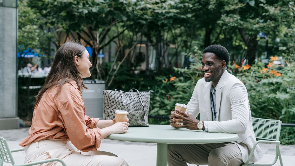 Two people talking at a cafe, an example of realistic dialogue