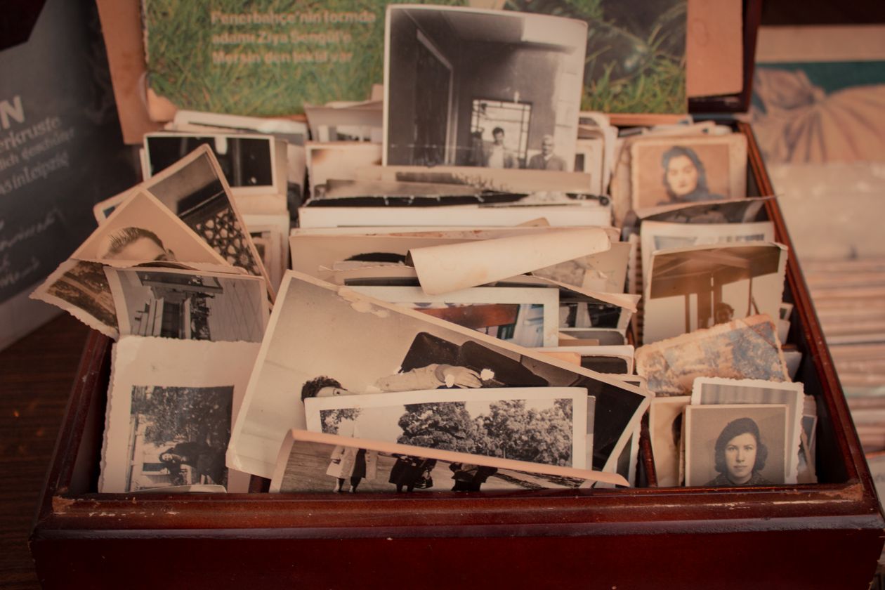 Old photographs in a wooden box, like the memories that form character backstory