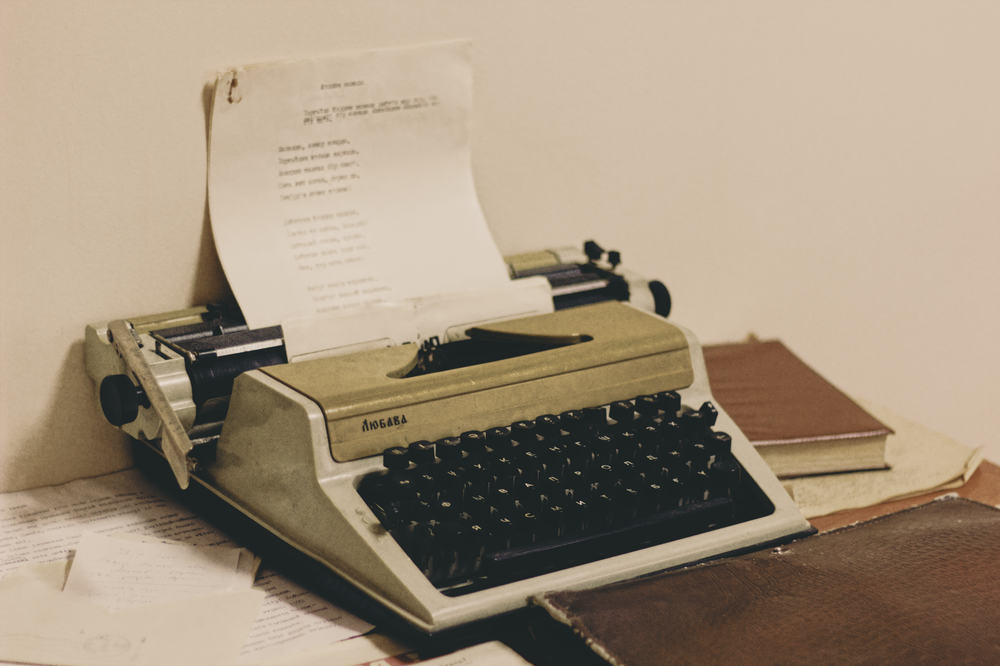 Vintage typewriter with a draft page, writing strong chapter endings
